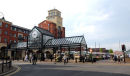 The end of School street, Wolverhampton showing the outdoor market and the new apartments in Market Square.